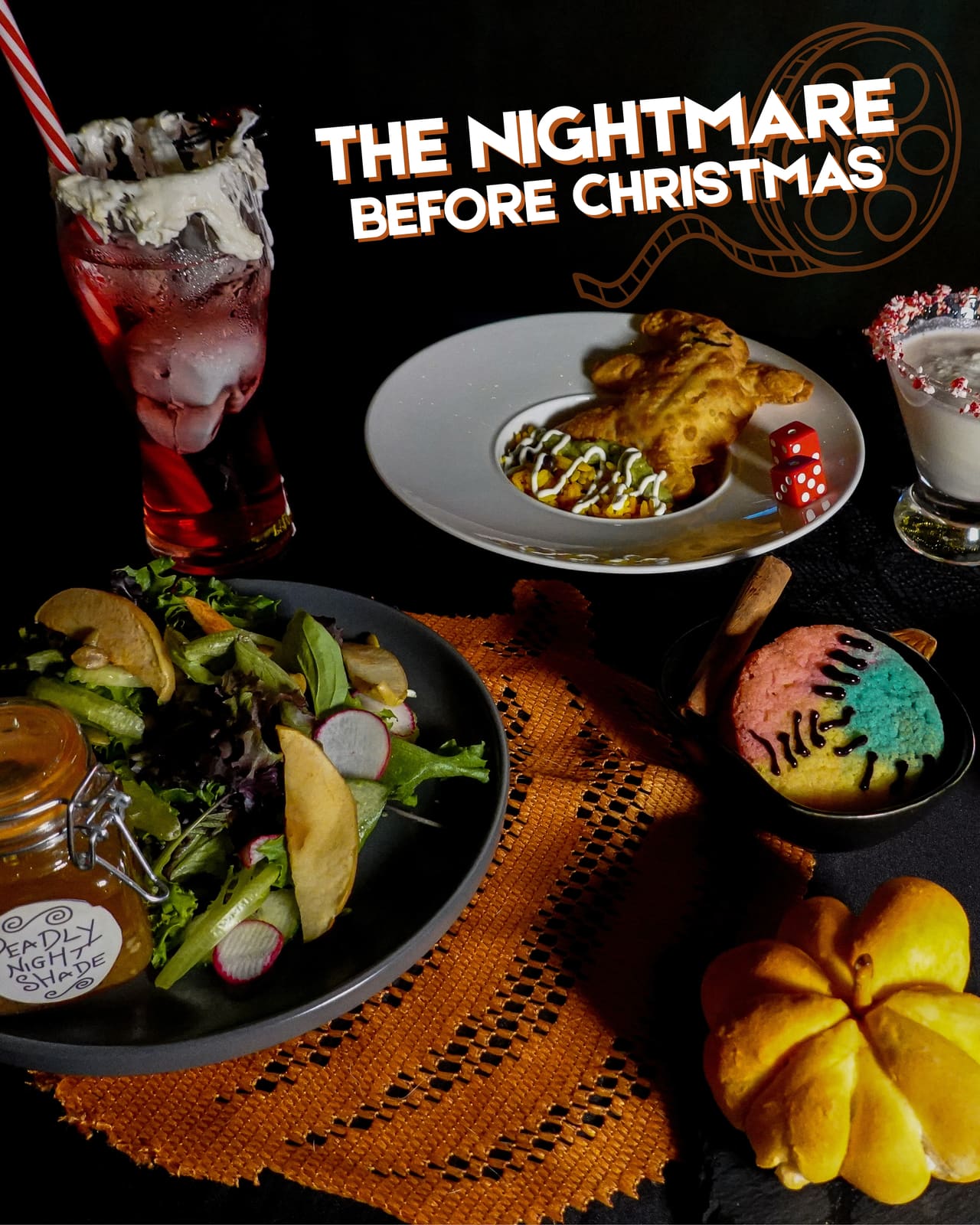 The Nightmare Before Christmas title graphic above plated courses and a striped cocktail